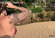 pervert shows tits on beach then fucks on rocks