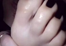 Polish lesbian self-worships feet coated in black nail polish