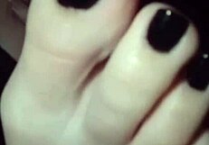 Polish lesbian self-worships feet coated in black nail polish