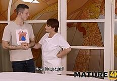 mature redhead's pussy subtly grinds against macho in erotic massage parlor