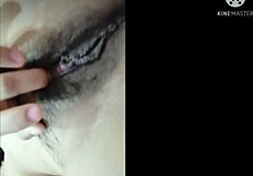 she fingers her wet pussy frantically until she explodes in orgasm