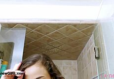 sexy brunette model strips nude in steamy bath fingering wet shaved pussy solo