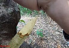 perverted bbw milf slut impales pussy on wooden stake squirting piss in forest