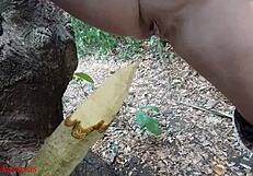 perverted bbw milf slut impales pussy on wooden stake squirting piss in forest