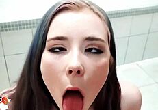 young cute babe kneels in shower giving sloppy blowjob to muscular bodybuilder's thick cock