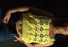 shaking her ass and hips rhythmically in sexy outfit with long nails