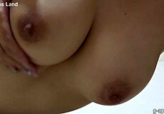 Japanese beauty reveals natural boobs in solo webcam tease