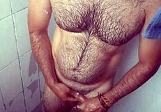 i hide stroking in shower splashing cum over my leg