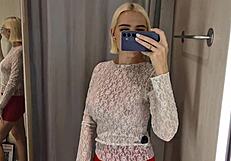 She slips into sheer transparent outfits in mall fitting room flashing big tits