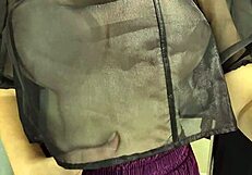 She slips into sheer transparent outfits in mall fitting room flashing big tits