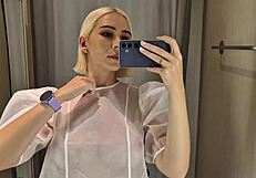 She slips into sheer transparent outfits in mall fitting room flashing big tits