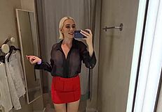 She slips into sheer transparent outfits in mall fitting room flashing big tits