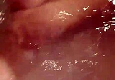 Woman enjoys extended bath session with self-touching and relaxation