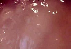 Woman enjoys extended bath session with self-touching and relaxation