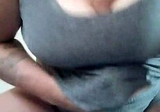 Tattooed brunette slut rams dildo between massive titties hard!