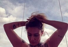 tattooed babe nearly kicked out of gym for see-through top with hard nipples from arousal