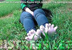 oh man my goddess feet look so cute in white socks jeans on spring grass