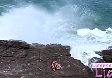 tarra white rims licks submissive babe's shaved pussy right on public beach