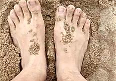 Sand hides bare feet's secret sensory fetish tease