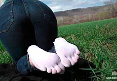 oh man my goddess feet look so cute in white socks jeans on spring grass