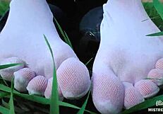 oh man my goddess feet look so cute in white socks jeans on spring grass