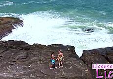 tarra white rims licks submissive babe's shaved pussy right on public beach