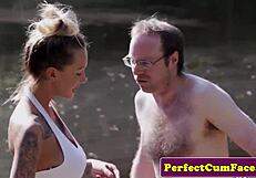 Busty tattooed beauty sucks pierced cock outdoors for thick facial cumshot