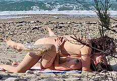 Passionate lovers fuck on beach with female squirting orgasms caught telephoto