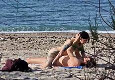 Passionate lovers fuck on beach with female squirting orgasms caught telephoto
