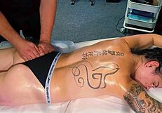 the male masseur oils up tattooed girl during massage but she begs for cock and he fucks her pussy hard