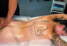 the male masseur oils up tattooed girl during massage but she begs for cock and he fucks her pussy hard
