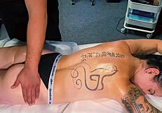 the male masseur oils up tattooed girl during massage but she begs for cock and he fucks her pussy hard