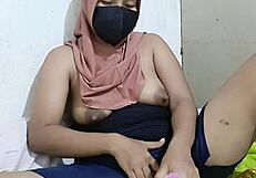 wanna watch hijab teacher finger her huge tits in viral vid?