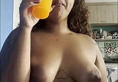 curvy babe sips coffee naked chatting with big tits on cam