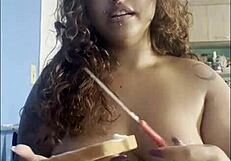 curvy babe sips coffee naked chatting with big tits on cam