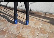 Discover her teasing curves in denim shorts black tights and tall heels