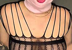 Masked beauty teases her curves solo