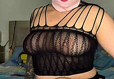 Masked beauty teases her curves solo