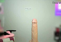 oiled busty babe tittyfucks huge toy cock till she cums