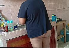 Chubby curvy stepmom cleans kitchen scrubbing every corner diligently