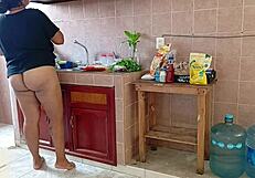 Chubby curvy stepmom cleans kitchen scrubbing every corner diligently