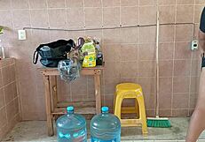 Chubby curvy stepmom cleans kitchen scrubbing every corner diligently