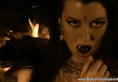 exotic indian babe strips nude by erotic fire