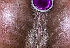 her anal plug slips in and pussy squirts effortlessly