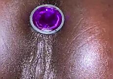 her anal plug slips in and pussy squirts effortlessly