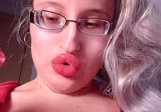 Red lipgloss bimbo goddess mesmerizes you into wallet-draining webcam lip worship session