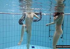 Shaved big tit brunette teases tight pussy underwater in shower