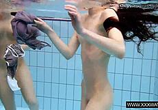 Shaved big tit brunette teases tight pussy underwater in shower