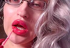 Red lipgloss bimbo goddess mesmerizes you into wallet-draining webcam lip worship session
