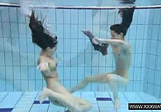 Shaved big tit brunette teases tight pussy underwater in shower